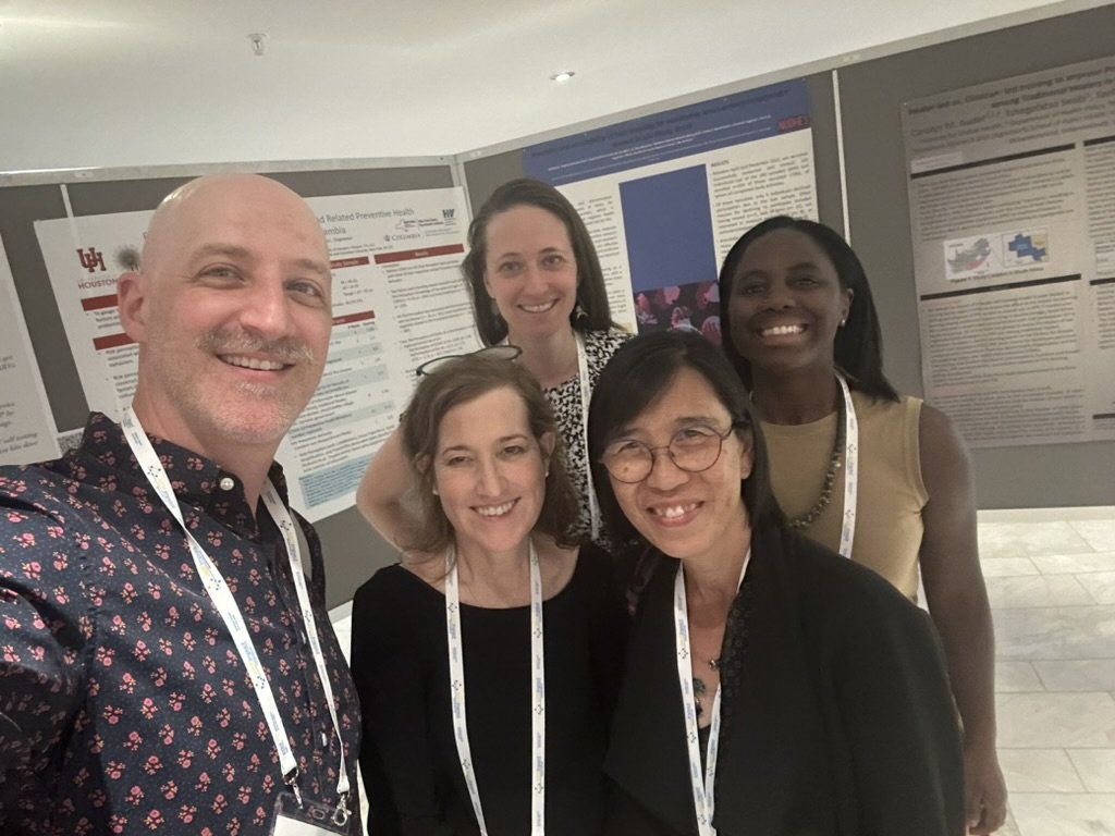 Several generations of T32 fellows with Program Director at AIDS IMPACT conference, June 2023